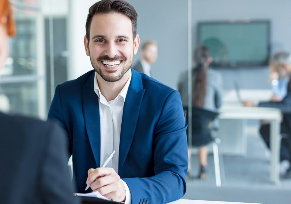 male employee smiling